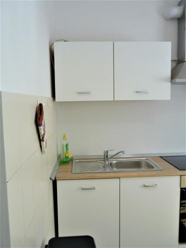 Kuchyň nebo kuchyňský kout v ubytování Cozy place