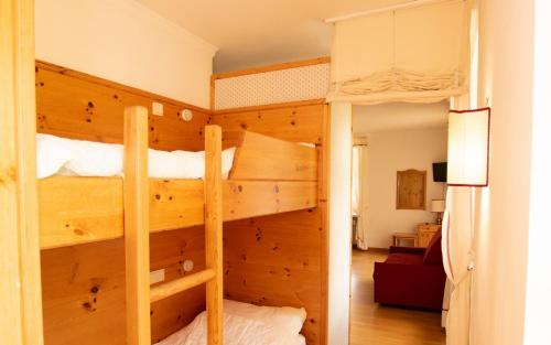 Poschodová posteľ alebo postele v izbe v ubytovaní Un soffio d’aria sulle Dolomiti