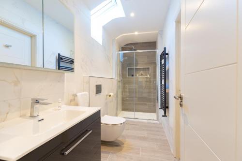 a bathroom with a sink and a toilet at Bective Stud Apartments in Navan