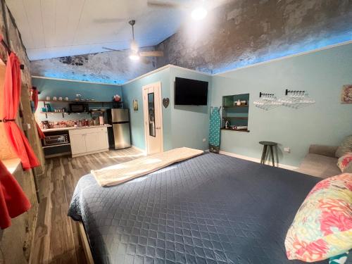a bedroom with a large bed in a room at Victoria House in Frederiksted