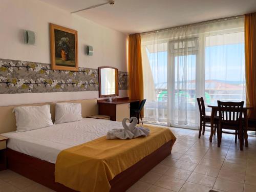 Postel nebo postele na pokoji v ubytování Hotel Onyx