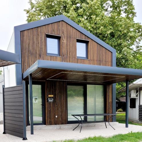 a building with a table on top of it at ARIA DELUXE Mobile Homes with Terme Čatež Tickets in Čatež ob Savi
