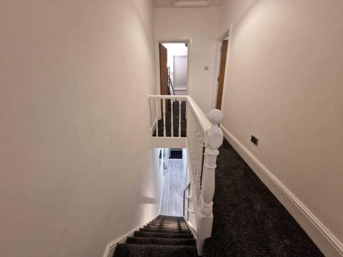 een trap in een huis met een trap bij Cyfarthfa House in Cardiff
