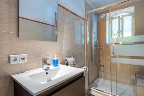 a bathroom with a sink and a shower at Can Xeliu in Sóller