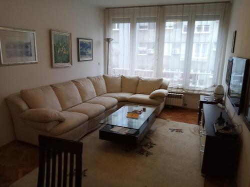 a living room with a couch and a coffee table at Appartment Center in Sarajevo
