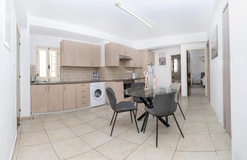 a kitchen with a table and chairs in a room at Private room in shared flat in Nicosia