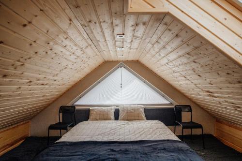 เตียงในห้องที่ Domek de Janauis