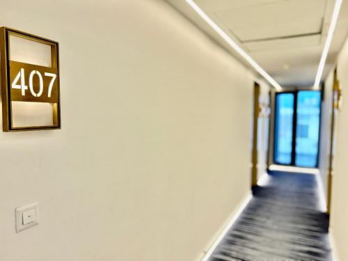 a hallway with a sign on a wall at Hotel Limon & Banquet Sector 29, Gurgaon in Gurgaon