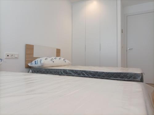 Postel nebo postele na pokoji v ubytování Residencial El Trenet 2C