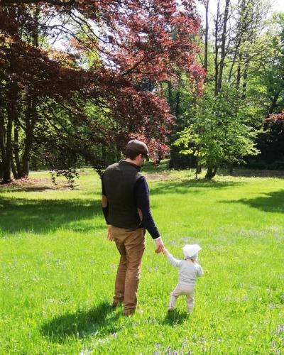 a man and a child holding hands in a field at Herrnhof in Reichenau