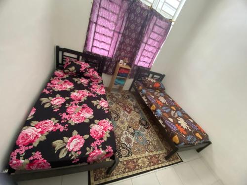 Katil atau katil-katil dalam bilik di Homestay D’Bella