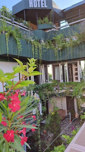 a hotel with plants on the side of it at Kai Hotel Bar in Tbilisi City