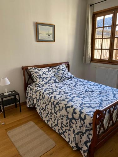 Postel nebo postele na pokoji v ubytování L’Hôtel Particulier de Lisieux