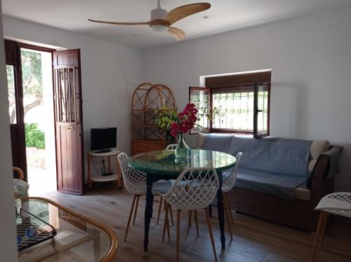 a living room with a table and a couch at Villa Garrido in El Pozo de los Frailes