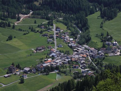 an aerial view of a small village in the mountains at Hotel Schweizerhof Sta Maria in Sta Maria Val Müstair