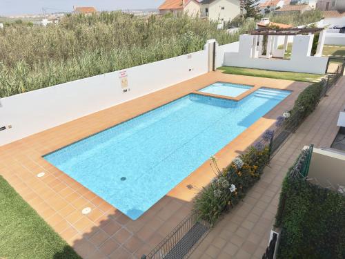 an overhead view of a swimming pool on a house at Baleal Happy Family Apartment in Ferrel