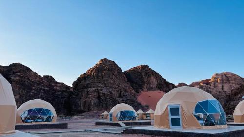 a group of domes in front of some mountains at Lulua luxury camp in Disah