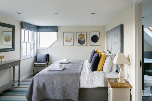 a bedroom with a bed and a bathroom at Stay on the Hill - Self Catered Cottages Laverick and Bothy in Hexham