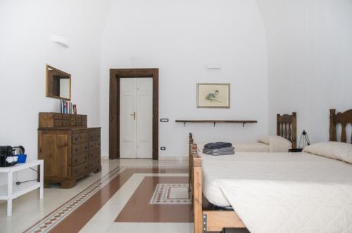 Ένα ή περισσότερα κρεβάτια σε δωμάτιο στο Palazzo Italia Apartments