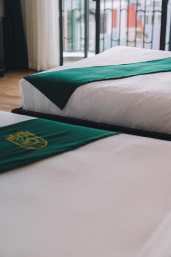 Кровать или кровати в номере Goldient Boutique Hotel
