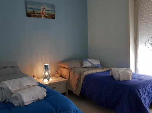 Cama ou camas em um quarto em La Maison di Arya