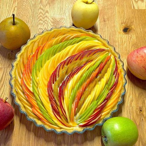 a colorful fruit pie on a table with apples at Villa Marina B&B in Cleto