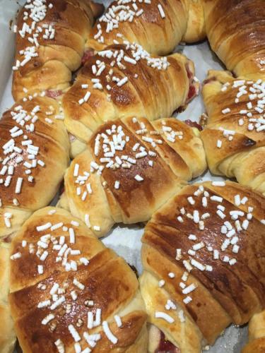 a pile of pastries with sesame seeds on top at Villa Marina B&B in Cleto