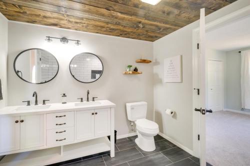 a bathroom with a sink and a toilet and a mirror at Beautiful Bellaire Home with Amenities, 4 Mi to Lake in Bellaire