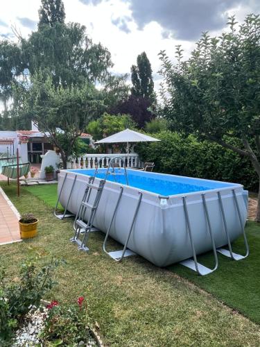 a row of boats sitting in a yard at Cuencaloft Casa Rural Cañada Molina in Arcas
