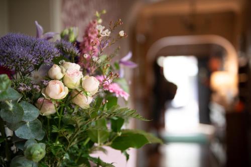 a bouquet of flowers in a vase at Adare Guesthouse in Galway