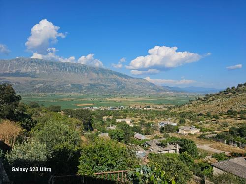 a view of a village with a mountain in the background at Xhumba Guesthouse 