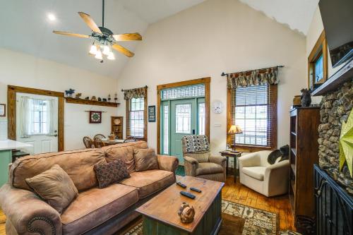 a living room with a couch and a tv at Lake Cumberland Resort Cabin with Community Perks! in Burnside