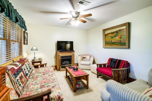 a living room with a couch and a tv at Lake Cumberland Resort Cabin with Community Perks! in Burnside