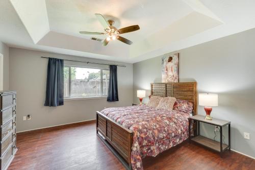 a bedroom with a bed and a ceiling fan at Pet-Friendly Medford Vacation Rental with Yard! in Medford