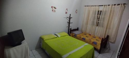 Кровать или кровати в номере Casa de Avó!! Agradável e aconchegante