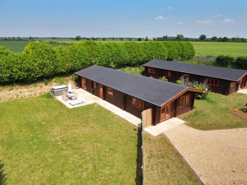 an overhead view of a house in a field at Pine Lodge in Oakham