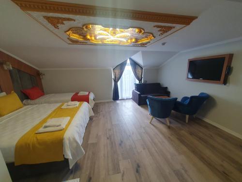 Ένα ή περισσότερα κρεβάτια σε δωμάτιο στο Dimora Gold Hotel