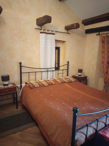 a bedroom with a large bed in a room at Apartment Staleta Tartuf in Livade
