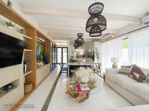 a living room with a couch and a table at House with Pool in Sector Bahia, Close to the Beach - Casa Amalia in San Carlos