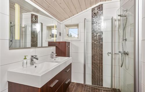 a bathroom with a sink and a shower at Gorgeous Home In Berger With House Sea View in Svelvik