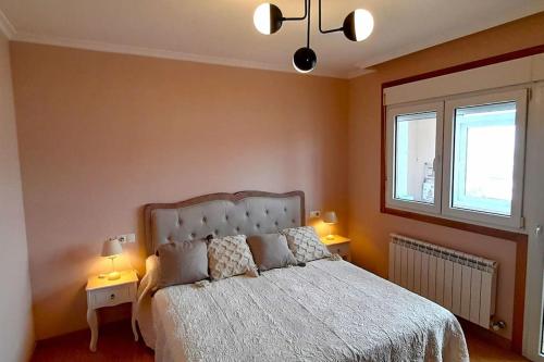 Llit o llits en una habitació de Apartamento vistas al mar