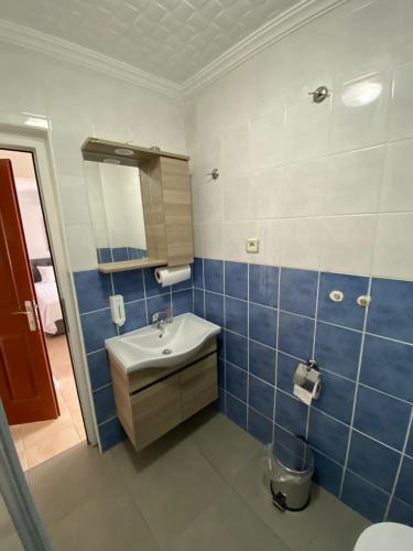 a bathroom with a sink and a mirror at FA&BER Homes in Marmaris