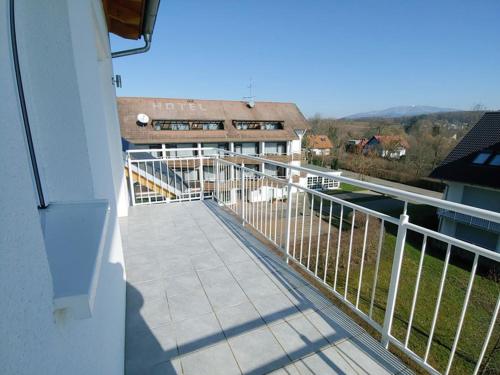 a balcony of a house with a view of a building at Luxury Golf Apartment Bad Bellingen 5-9 in Bad Bellingen