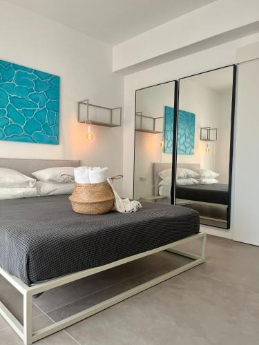 a bedroom with a bed and a large mirror at Il Volo in Sperlonga