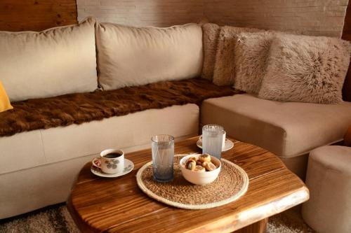 a living room with a couch and a coffee table at Milošev Konak in Malo Središte