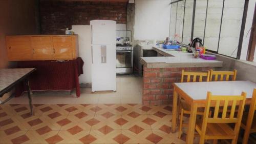 A kitchen or kitchenette at Nery Lodging