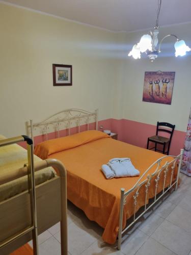 Ένα ή περισσότερα κρεβάτια σε δωμάτιο στο Casa Sibarys 20 mt dalla Stazione piano terra