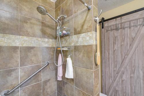 a shower in a bathroom with a shower curtain at Houston Vacation Rental about 10 Mi to Downtown in Houston