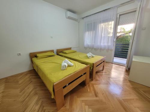 Vuode tai vuoteita majoituspaikassa Happy apartment Strumica 2