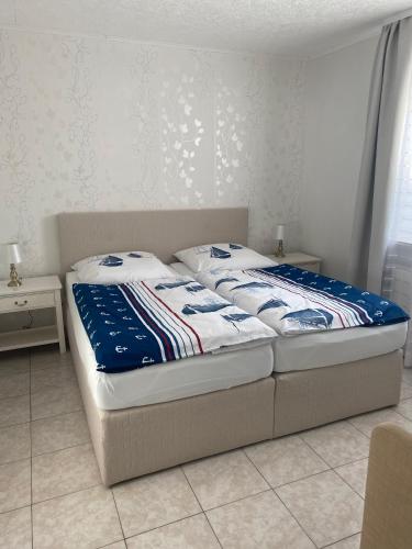 a bed sitting in a room with at Ostsee Ferienwohnung in Scharbeutz